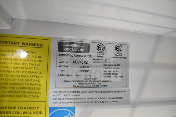 Label on Arctic Air commercial refrigerator model AUC48RZ showing specifications, made in China by Broich Enterprises.