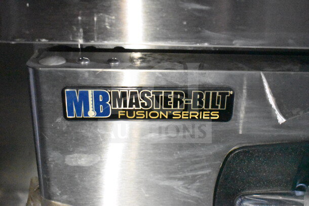 Master-Bilt Fusion Series label on stainless steel equipment inside 2021 Rock Solid Cargo 28ft food trailer.