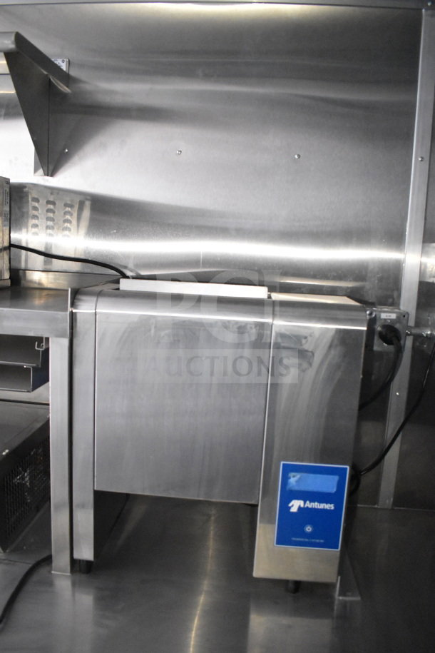Rock Solid Cargo 28ft food trailer interior, featuring Antunes equipment and CaptiveAire hood system in stainless steel finish.