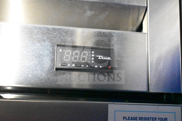 Digital temperature display on a stainless steel appliance in the 2021 Rock Solid Cargo 28ft commercial food trailer.
