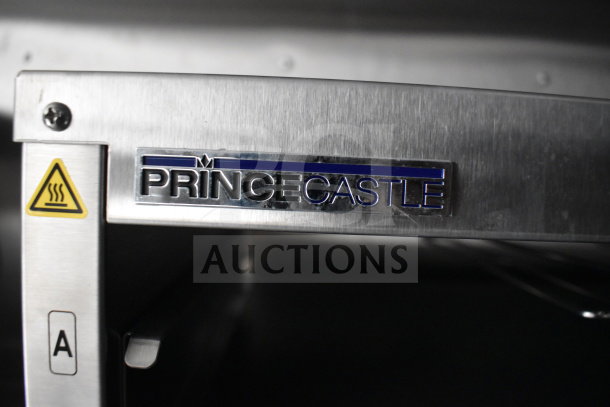 Alt text: "Prince Castle heating equipment inside 2021 Rock Solid Cargo 28ft food trailer, with warning label."