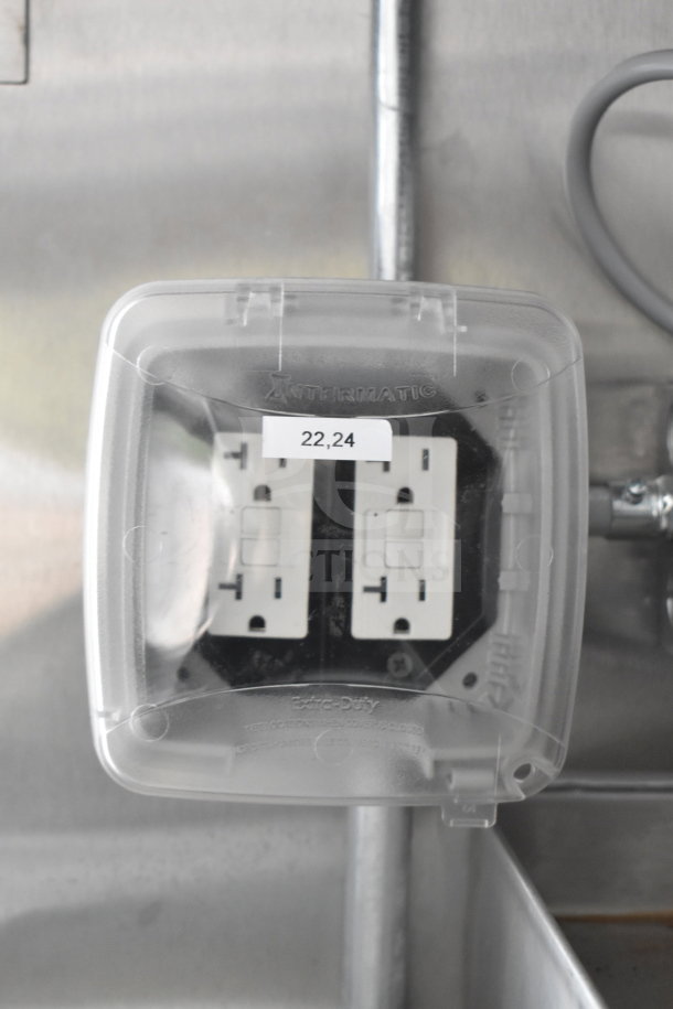 Intermatic Extra Duty outlet cover in new Rock Solid Cargo 28ft food trailer. Label reads "22,24."