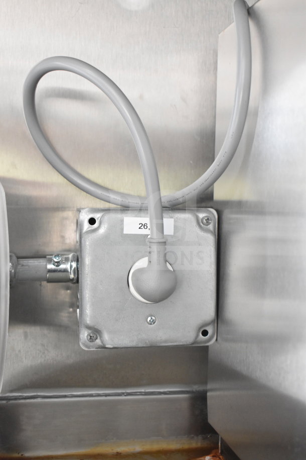 Electrical outlet in Rock Solid Cargo 2021 food trailer. Gray conduit and screws visible, labeled "26". New condition.