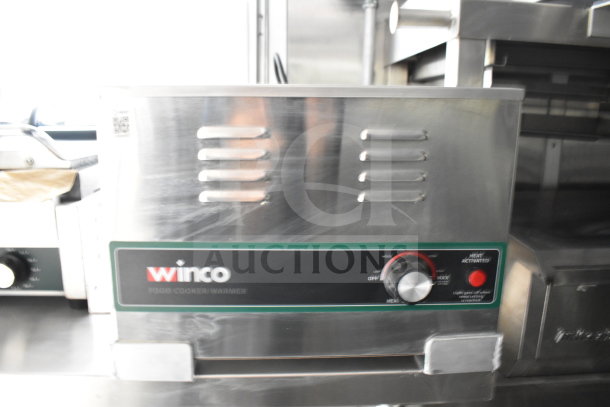 Winco food cooker/warmer in new condition inside a 2021 Rock Solid Cargo 28ft commercial food trailer.