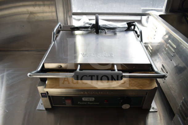 2021 Rock Solid Cargo 28ft food trailer with Waring Panini Supremo grill. Features commercial-grade equipment.