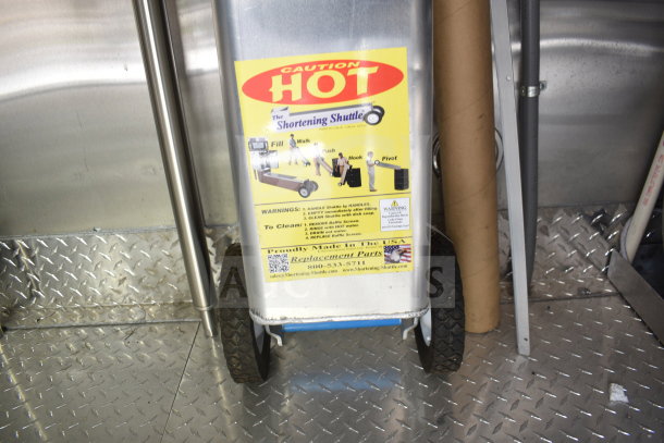 New 2021 Rock Solid Cargo 28ft food trailer with CaptiveAire hood, refrigeration, Nieco charbroiler. Caution "Hot" warning on equipment.