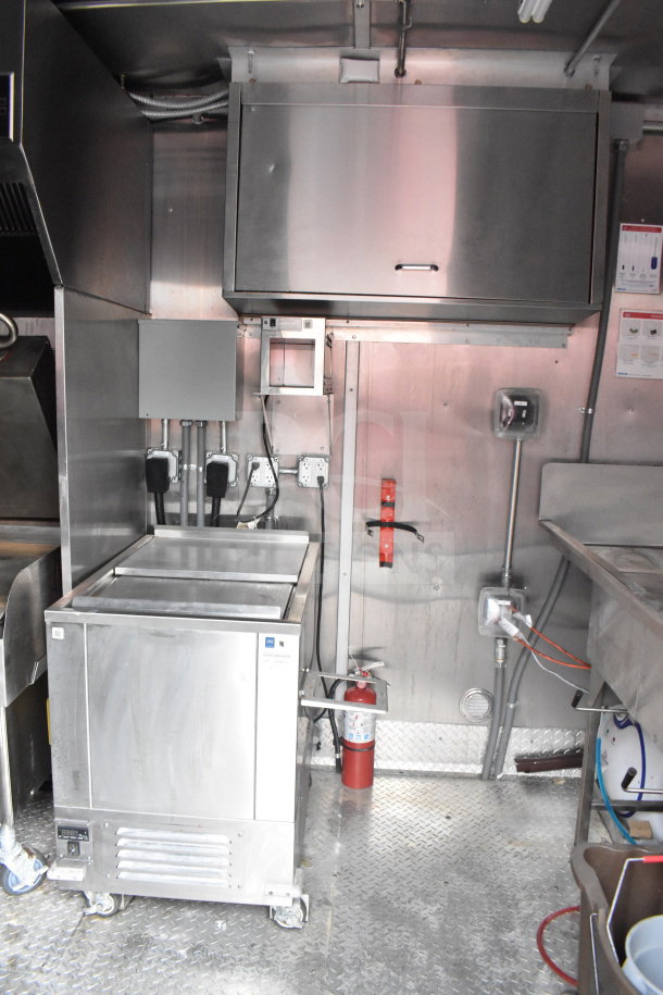 2021 Rock Solid Cargo 28ft food trailer interior with Henny Penny fryer, Taylor griddle, and full refrigeration setup.