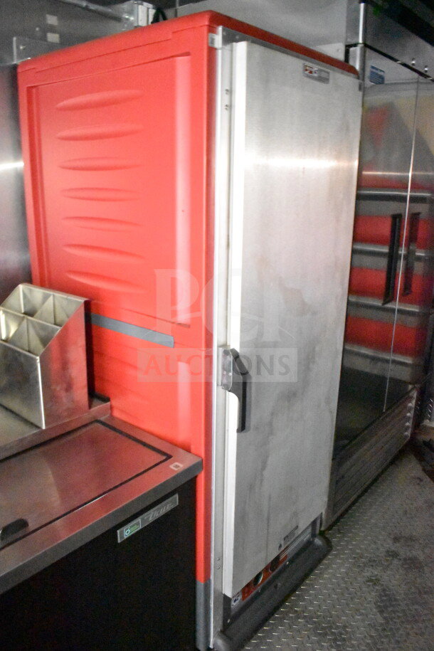 2021 Rock Solid Cargo 28ft food trailer interior featuring a red and stainless steel refrigeration unit.
