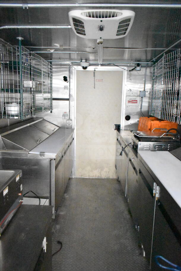 NBRHD Kitchens food trailer with dual Pitco gas fryers, CaptiveAire hood, Arctic Air refrigeration, and Daikin mini-split.
