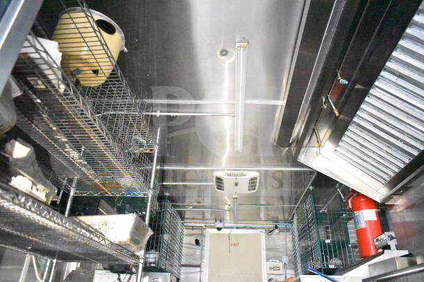 NBRHD Kitchens food trailer interior with dual Pitco gas fryers, CaptiveAire hood, Arctic Air refrigeration, Daikin mini-split.