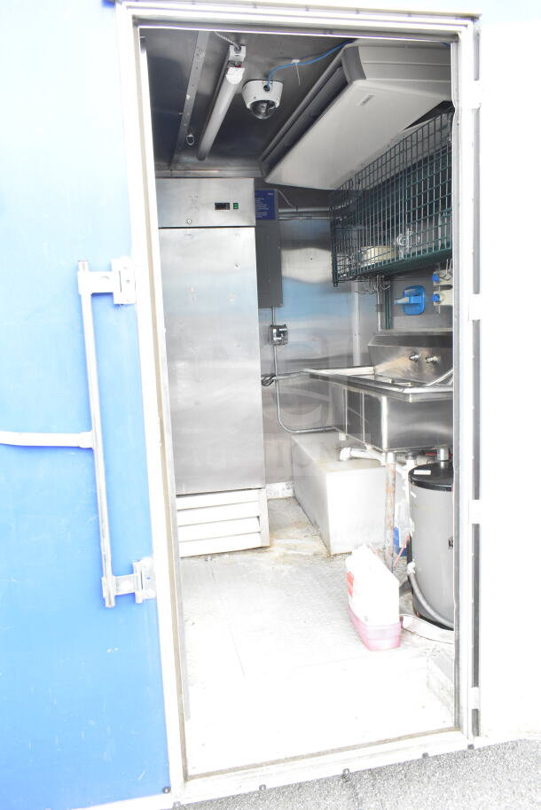 NBRHD Kitchens Ghost Kitchen food trailer interior with dual Pitco gas fryers, CaptiveAire hood, Arctic Air refrigeration, Daikin mini-split.