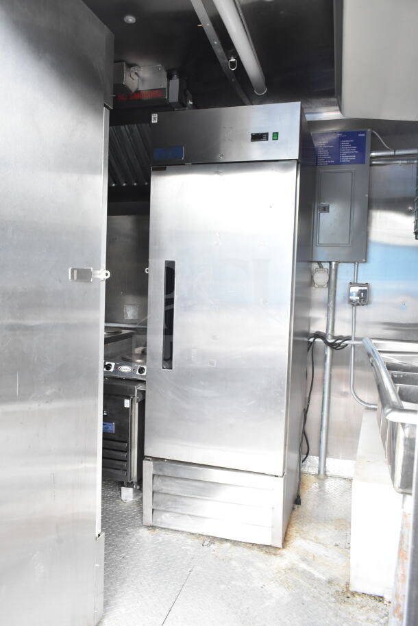 NBRHD Kitchens Ghost Kitchen trailer with stainless steel interior, dual Pitco gas fryers, CaptiveAire hood, Arctic Air fridge.