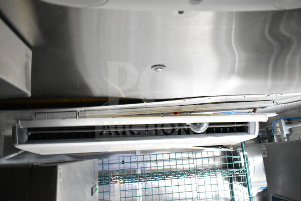 NBRHD Kitchens food trailer interior showing a Daikin mini-split AC unit beneath a metal ceiling.