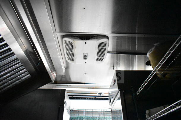 Food trailer interior with CaptiveAire hood and Daikin mini-split. Includes Arctic Air refrigeration and dual Pitco gas fryers.