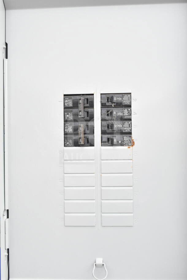 Electrical breaker panel with multiple switches, includes 40 amp breakers. White panel with 20 slots, some occupied.