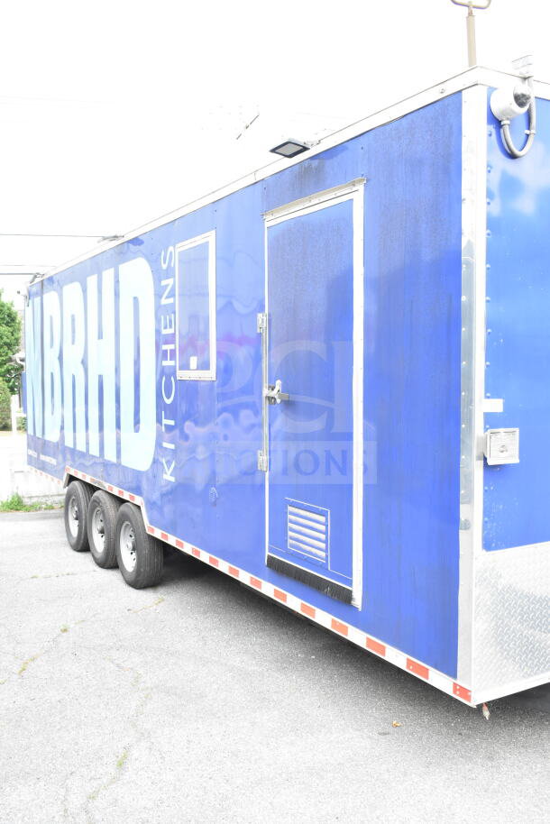 Blue 2021 Rock Solid Cargo 28ft food trailer. Features CaptiveAire hood, fire suppression, Nieco BroilVection, Frymaster fryer.