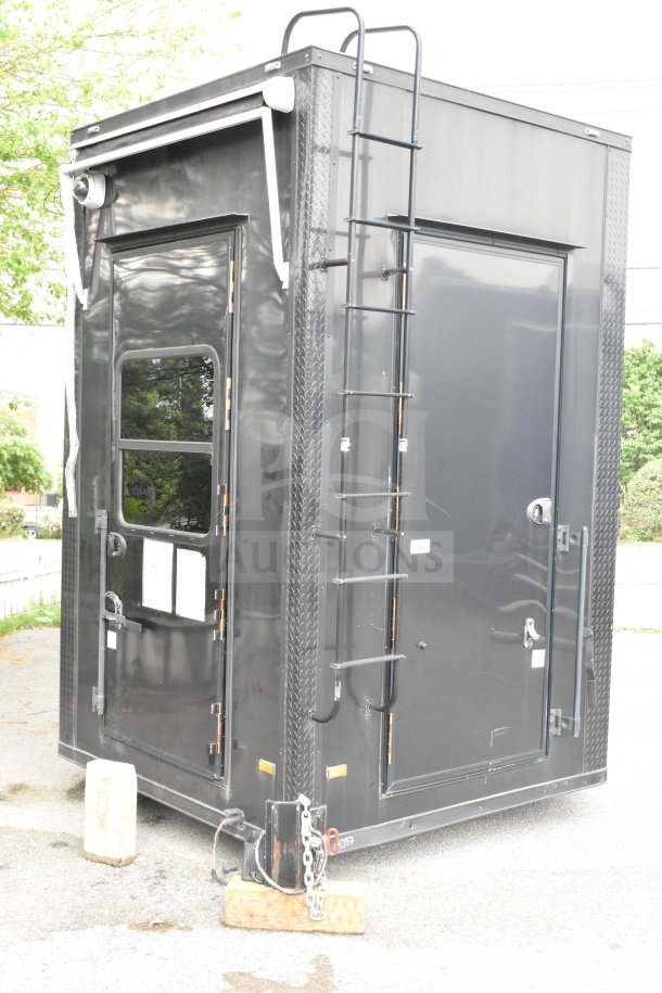 2020 Southern Dimensions Group 20ft all-black mobile commissary trailer, tandem axle, with ladder and security camera.