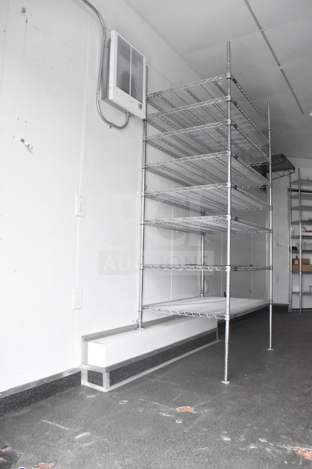Interior of a 2020 Southern Dimensions Group 20ft mobile trailer with metal wire shelving and an installed air conditioner.