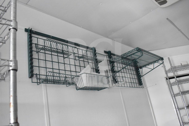 Interior of 2020 Southern Dimensions Group 20ft trailer showing wire shelving, wall-mounted slots, and IT/network cabinet.