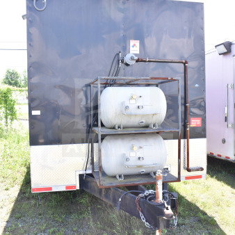 2021 Cruising Kitchens 8.5'x24' food trailer, black exterior, propane tanks visible, VIN 7PLBC2429MM000193.