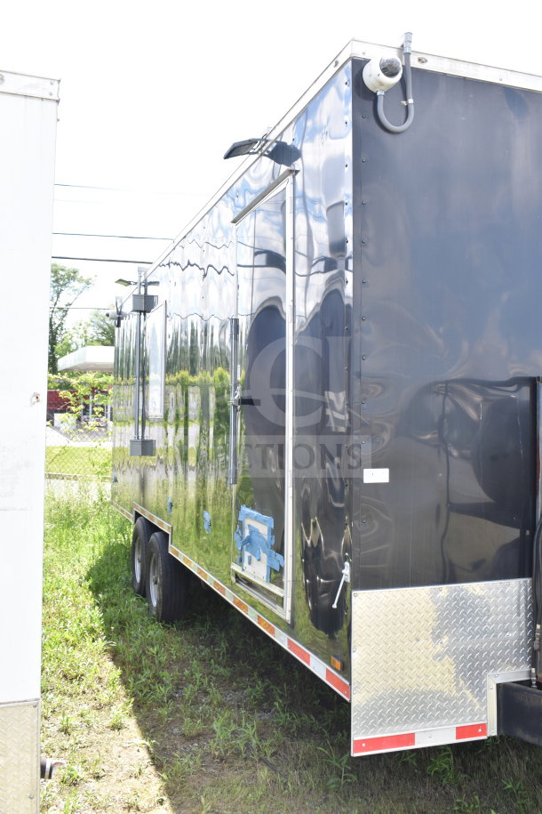 2021 Cruising Kitchens 8.5'x24' food trailer, black exterior, dual axles, excellent condition, VIN: 7PLBC2429MM000193.