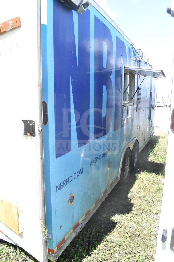 2020 Diamond Cargo 8.5'x24' food trailer with side serving window, exterior signage, and dual axle. VIN: 53NBE2422L1083693.