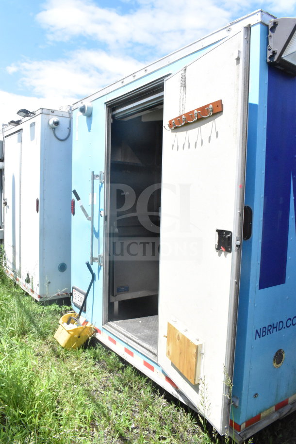 2020 Diamond Cargo 8.5'x24' food trailer, partially open door showing interior, good condition, VIN 53NBE2422L1083693.