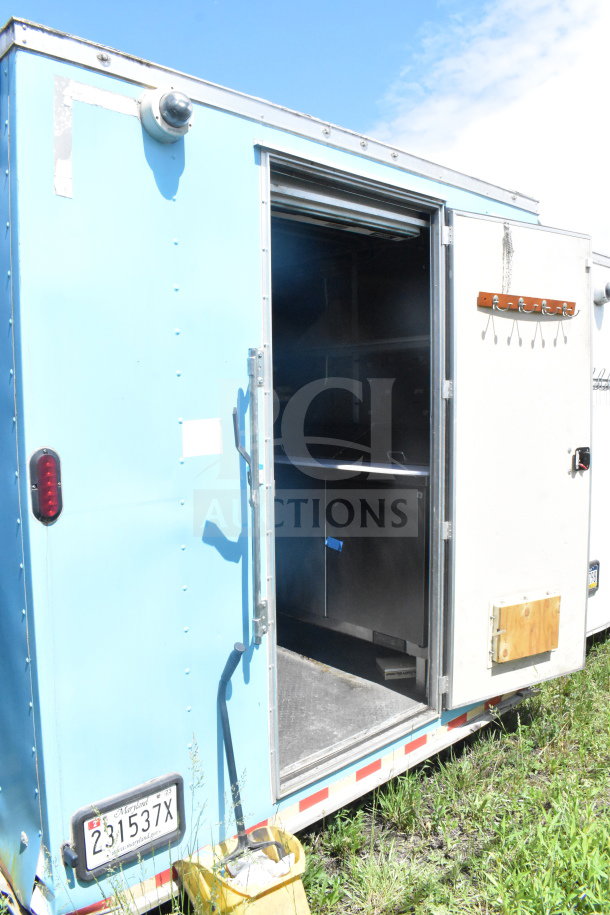 2020 Diamond Cargo 8.5'x24' food trailer, blue exterior, open side door, interior view, Maryland plate 231537X.
