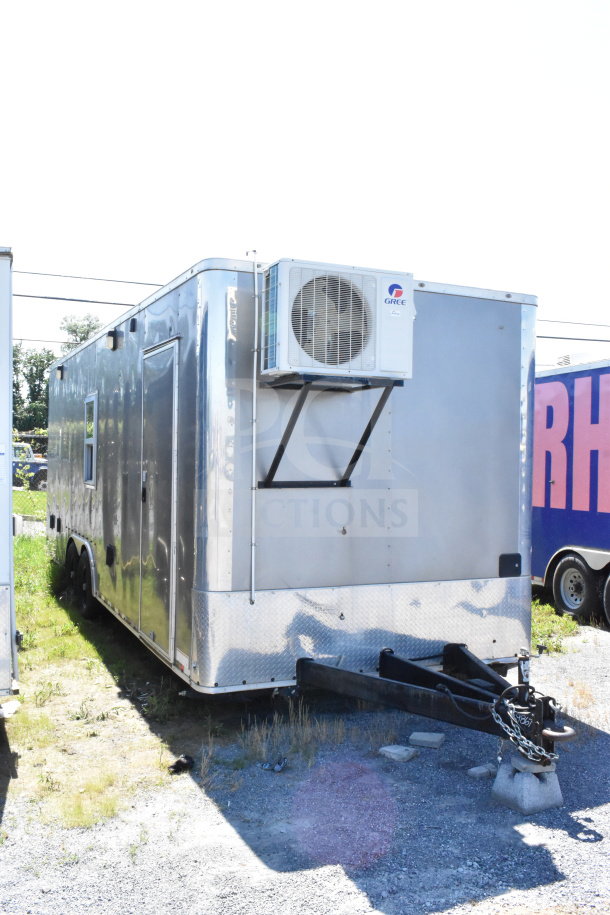 2021 Diamond Cargo 8.5'x24' food trailer with exterior fan, reflective metal finish, excellent condition. VIN: 53NBE2424M1089867.