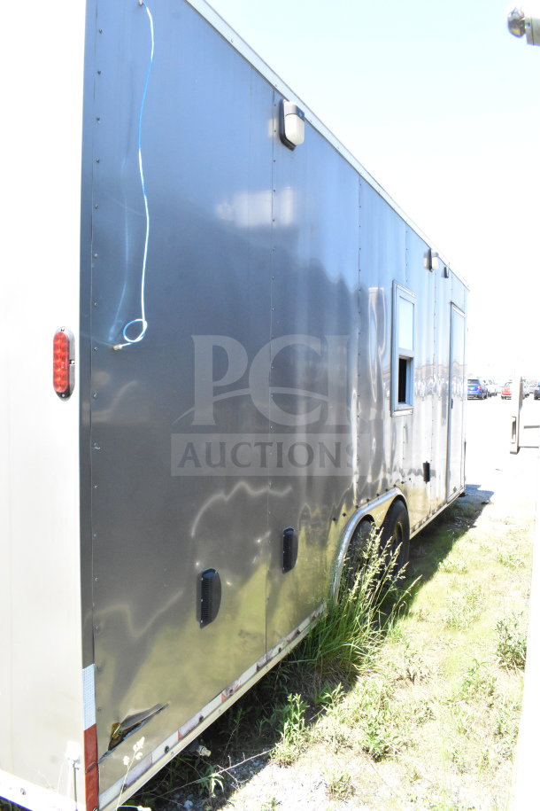 2021 Diamond Cargo 8.5'x24' food trailer, gray exterior, dual axle, visible wear and tear, VIN: 53NBE2424M1089867.