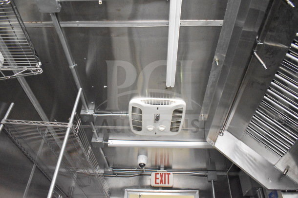 2021 Cruising Kitchens 8.5'x24' food trailer interior showing CaptiveAire ventilation system, shelves, and stainless steel finish.