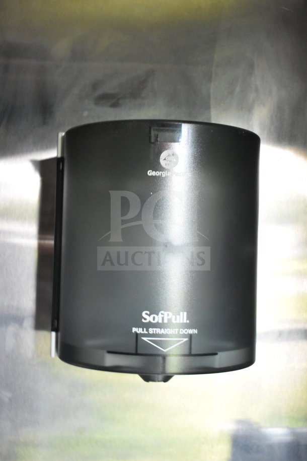 Georgia-Pacific SofPull paper towel dispenser in a stainless steel interior, part of the Cruising Kitchens food trailer.