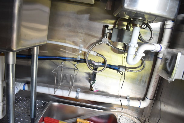 2021 Cruising Kitchens 8.5'x24' food trailer piping and plumbing details. Includes visible drainage and fixtures.