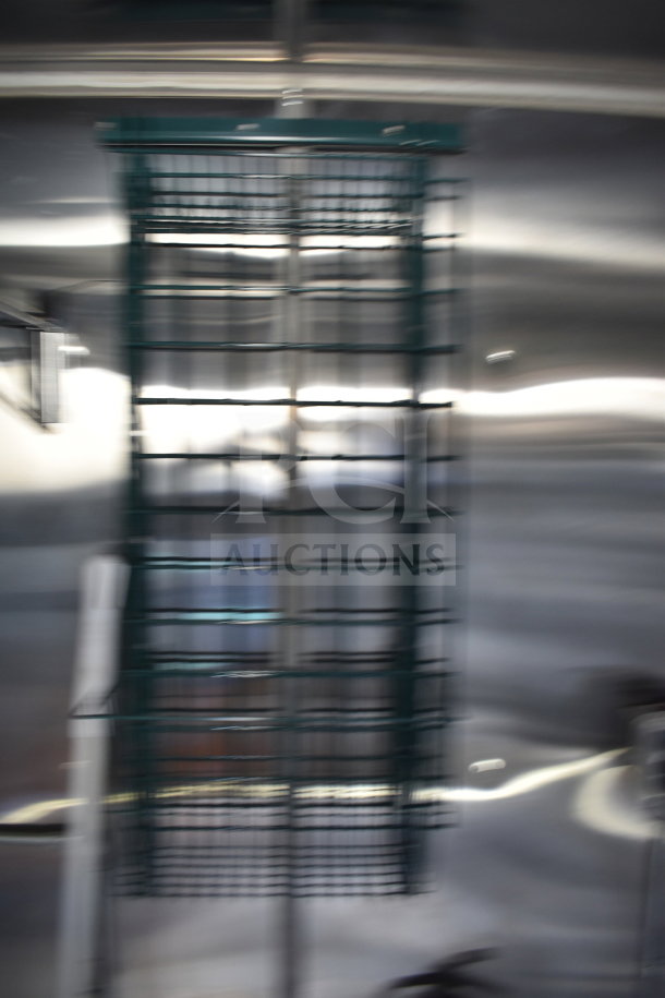 Blurry image of a structure, likely part of the interior of a food trailer. Specific features are unclear.