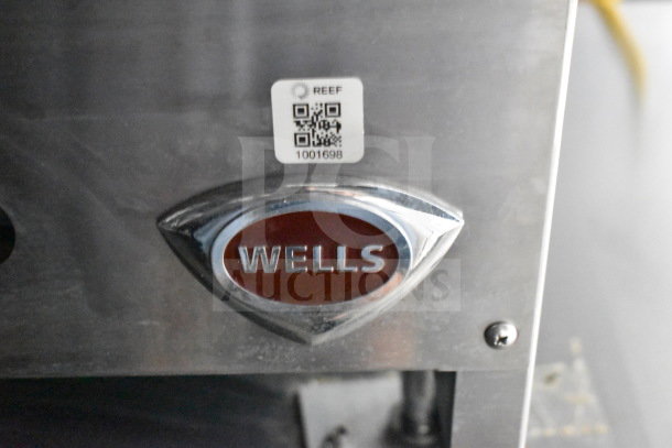2021 Cruising Kitchens food trailer part featuring a Wells emblem and a REEF tag with QR code.