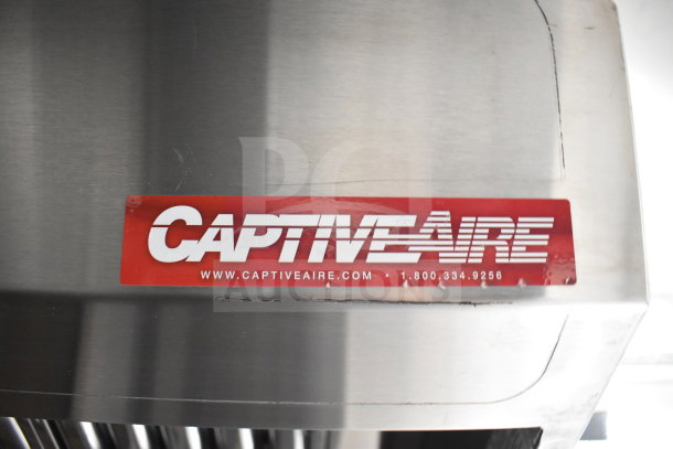 CaptiveAire grease hood in stainless steel, featuring brand logo and contact details on a red label.