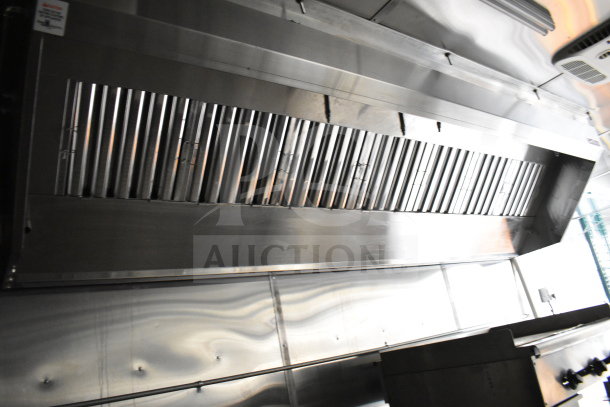 2021 Cruising Kitchens 8.5'x24' food trailer interior featuring CaptiveAire grease hood, suppression system, and stainless steel finish.