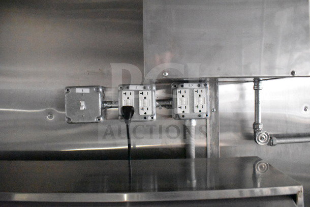 Electrical outlets inside 2021 Cruising Kitchens 8.5'x24' food trailer. Visible labels: 1, 3, 5, 7. Stainless steel interior.