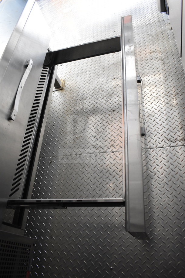 2021 Cruising Kitchens 8.5'x24' food trailer interior, diamond plate flooring, stainless steel fittings, good condition.