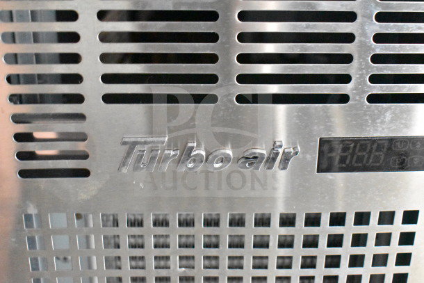 Close-up of Turbo Air refrigeration system inside a 2021 Cruising Kitchens food trailer, showcasing vent details.