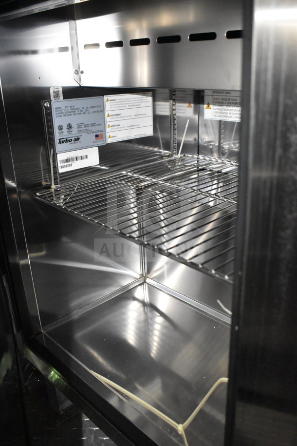 2021 Cruising Kitchens food trailer interior, featuring a Turbo Air refrigeration unit with visible compliance tags.