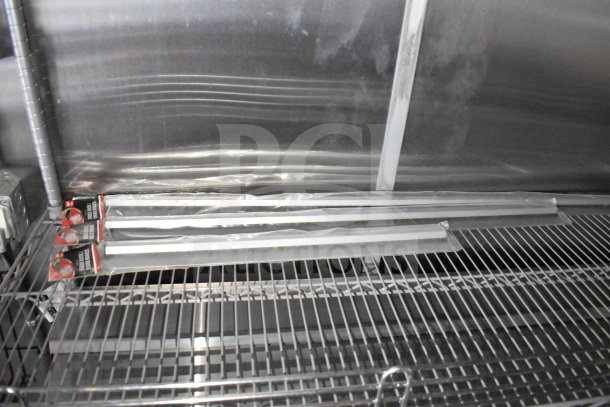 2021 Cruising Kitchens 8.5'x24' food trailer interior, stainless steel shelving, CaptiveAire grease hood, new condition.
