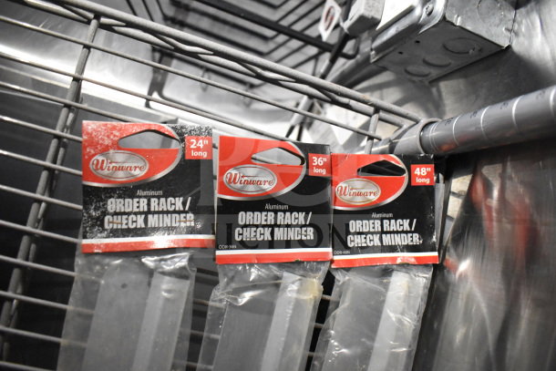 Packaging of Winware aluminum order rack/check minder, lengths 24", 36", 48", displayed on a rack.
