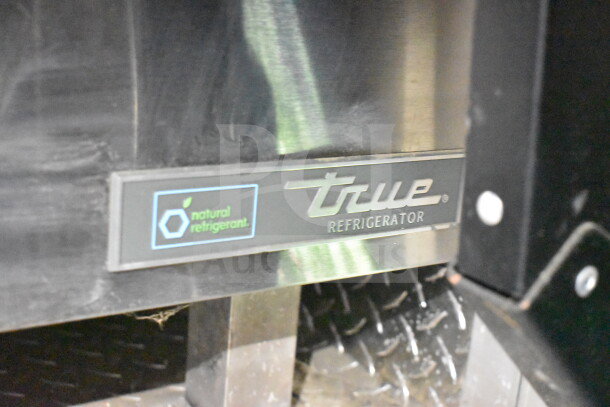 True Refrigerator label with "natural refrigerant" icon in 2021 Cruising Kitchens Food Trailer, detail view.