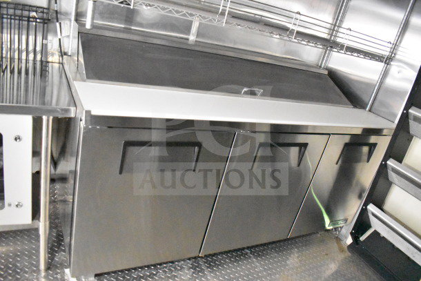2021 Cruising Kitchens food trailer interior with refrigeration unit, stainless steel, griddle surface.