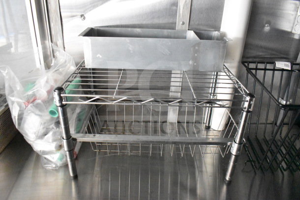 2021 Cruising Kitchens 8.5'x24' food trailer with metal shelving inside, featuring refrigeration and a CaptiveAire grease hood.