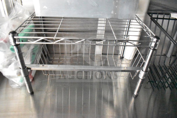 2021 Cruising Kitchens food trailer interior, featuring a metal wire rack. Clean and well-maintained.
