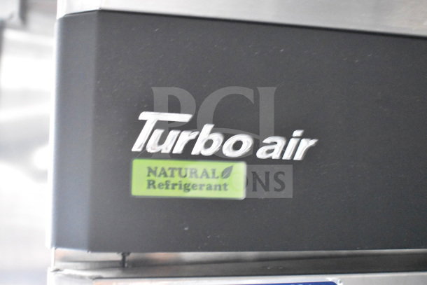Turbo Air refrigeration system label, featuring "Natural Refrigerant" sticker on Cruising Kitchens food trailer.
