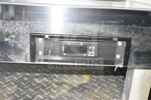 Control panel of a 2021 Cruising Kitchens food trailer, featuring a Dixell temperature display, set in a metal frame.