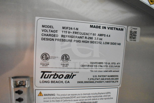 Label on the 2021 Cruising Kitchens food trailer includes model M3F24-1-N, voltage 115V, refrigerant R-290 info, and Turbo Air branding.